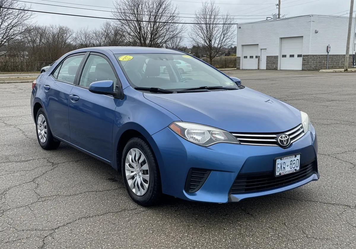2016 Toyota Corolla LE blue sedan front three-quarter listing photo